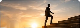 Person climbing steps at sunrise